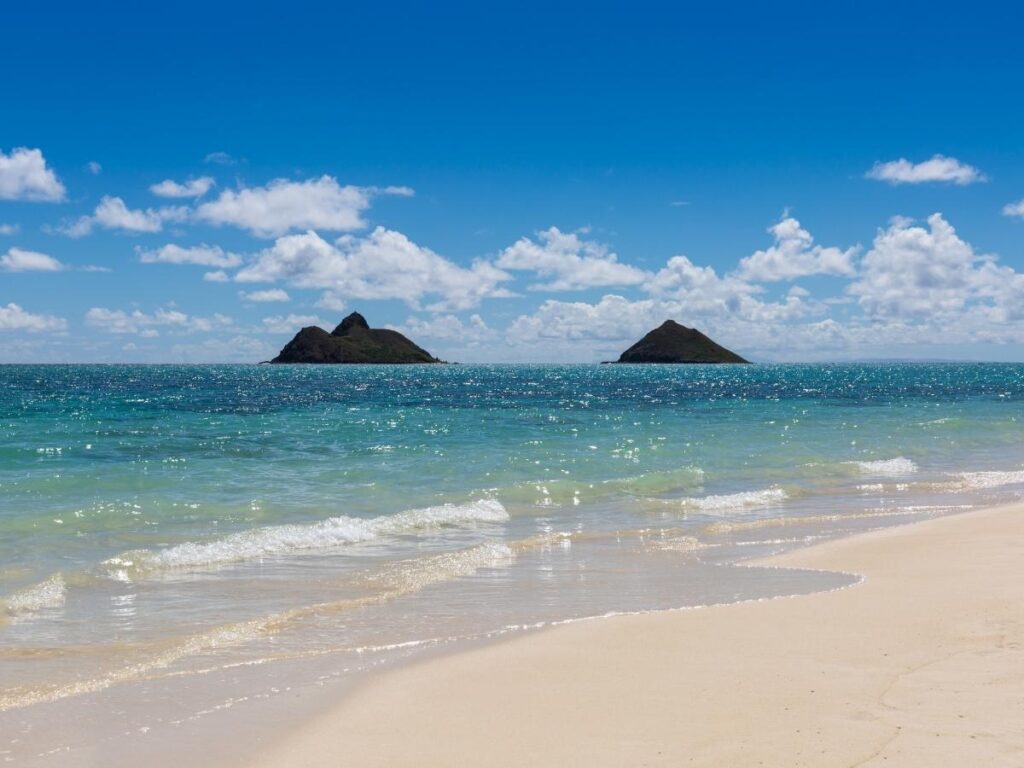 Wide sandy shoreline at Kailua Beach Park on a calm morning in Oahu