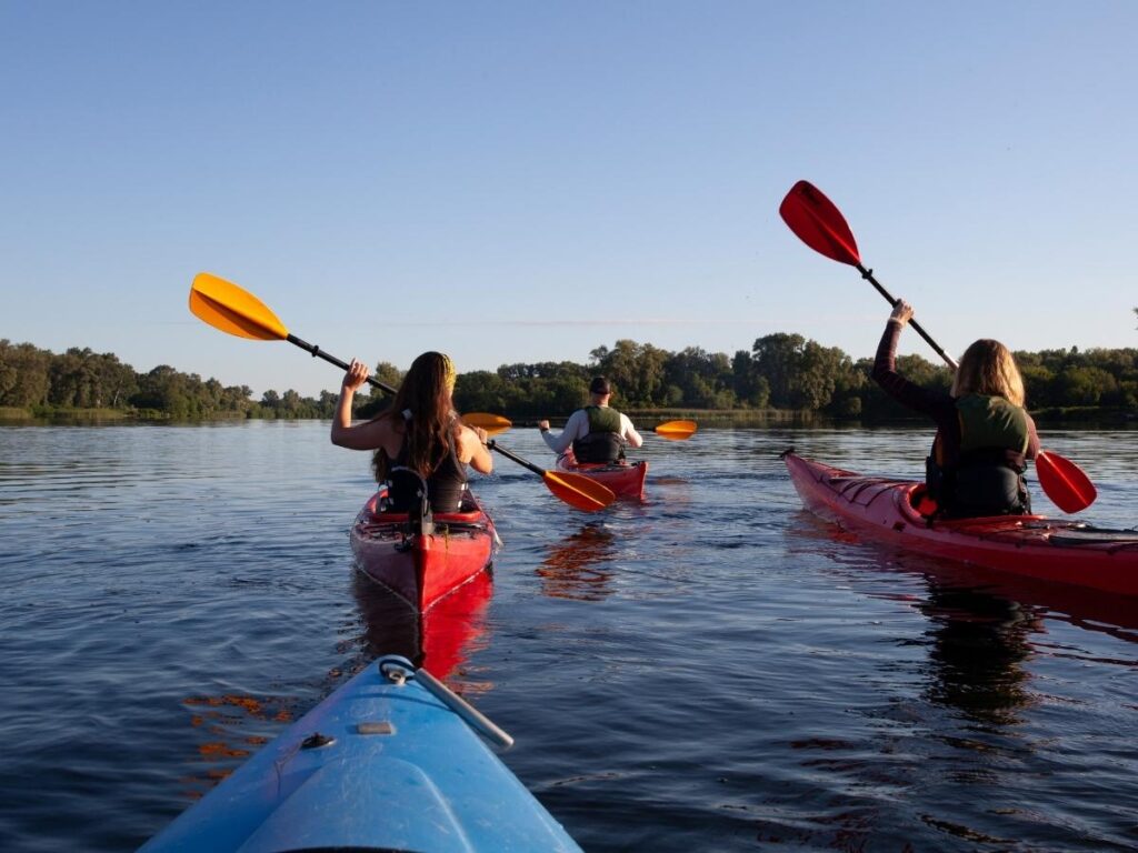 Kayakers paddling from Lanikai Beach toward the Mokulua Islands in Kailua Oahu
