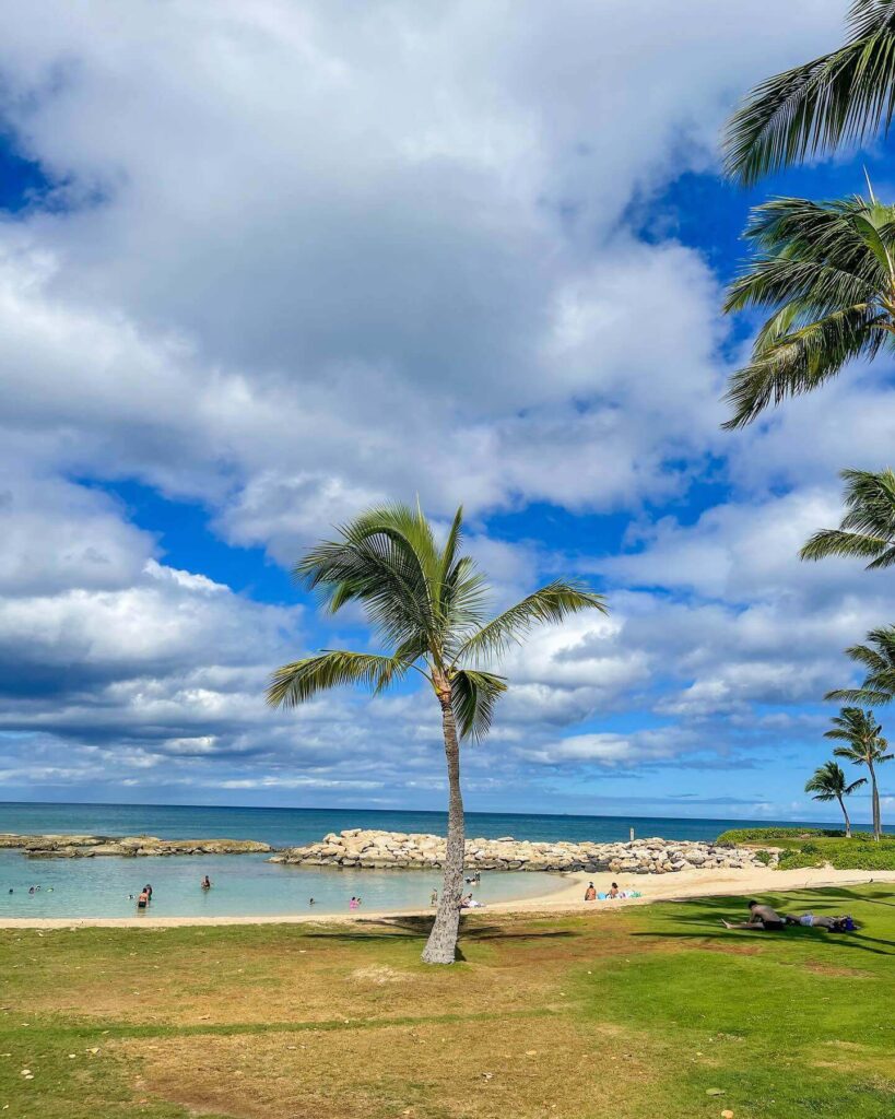 People relaxing in calm lagoon water in Kapolei Oahu
