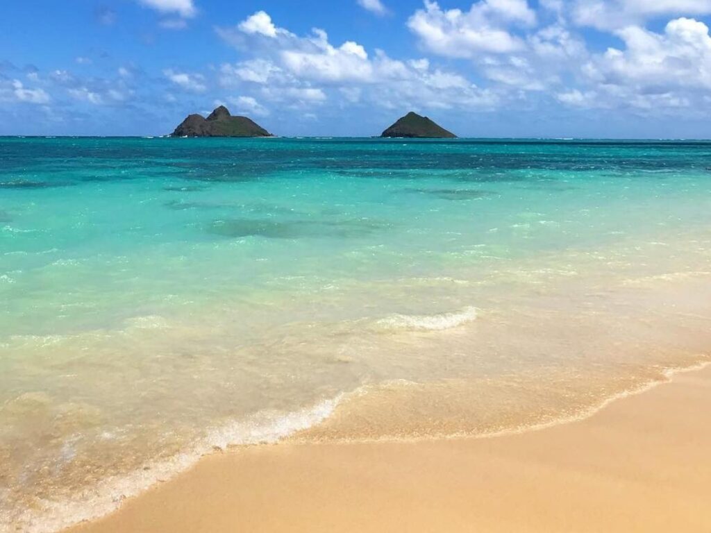 Sunrise at Lanikai Beach in Kailua Oahu with the Mokulua Islands offshore