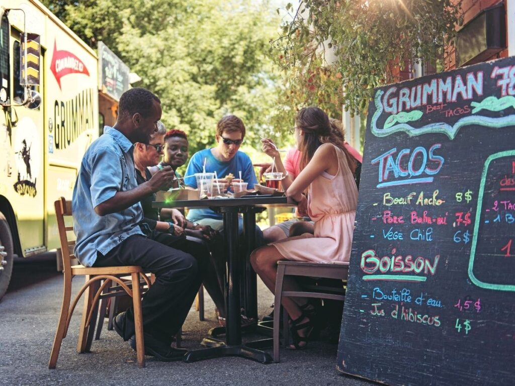 Taco stand in Mexico City with handwritten Spanish menu