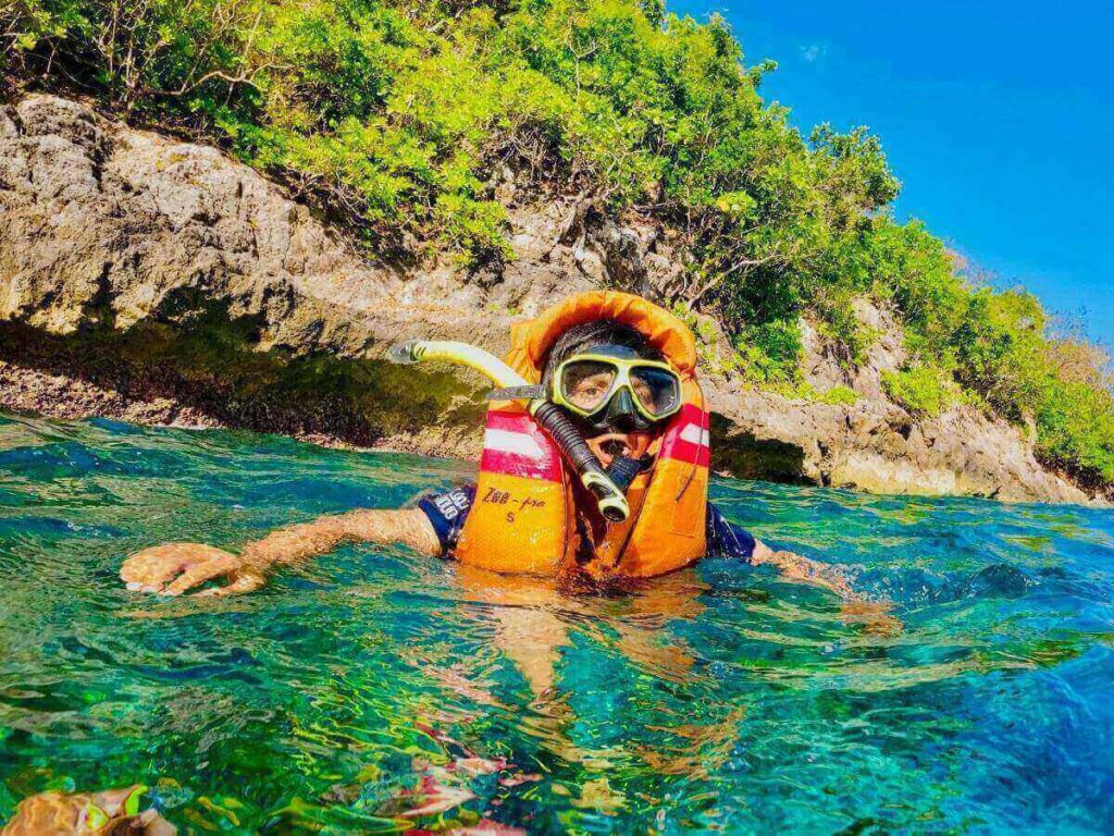 Napili Bay in Maui with calm water and rocky edges ideal for snorkeling
