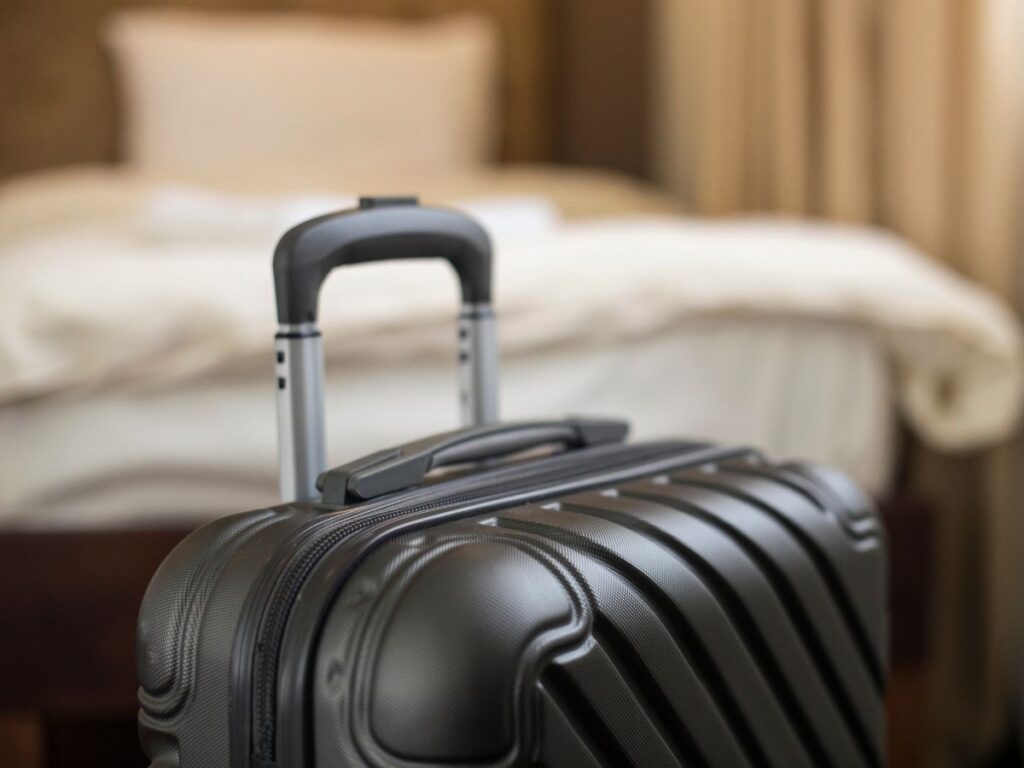 Luggage standing upright in a hotel
