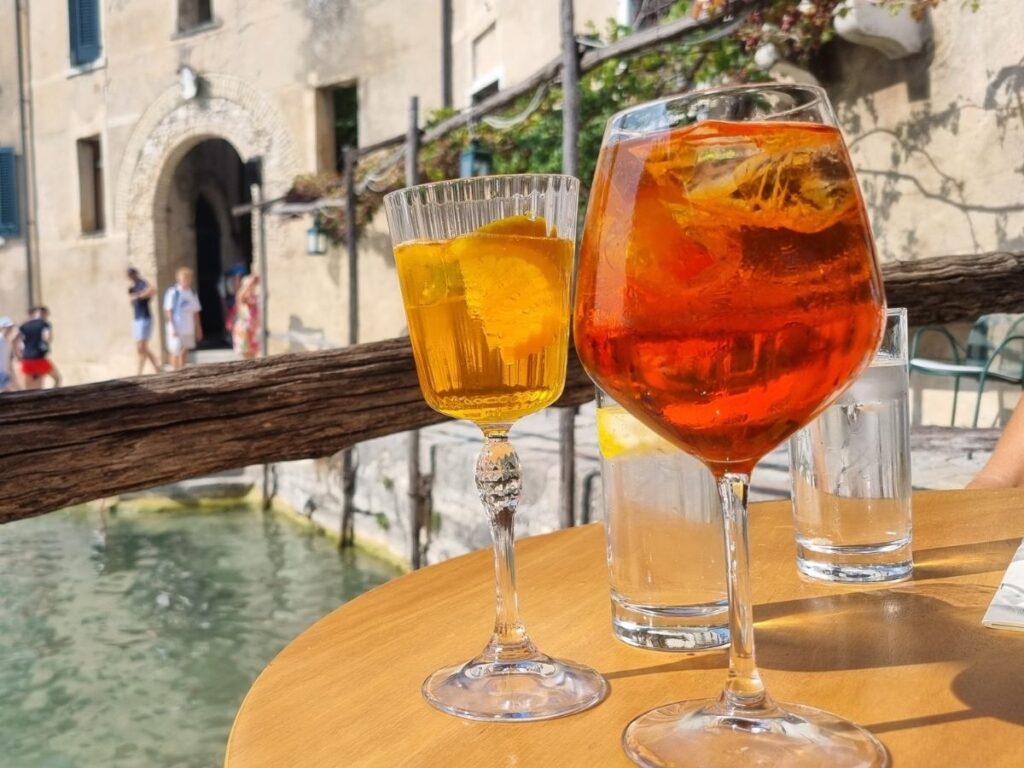 Aperol spritz on a Positano terrace with Amalfi Coast view