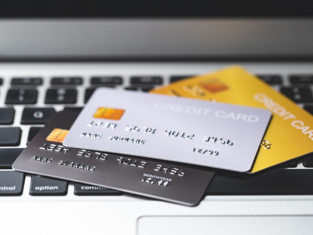 Traveler checking hotel loyalty rewards and credit card travel benefits