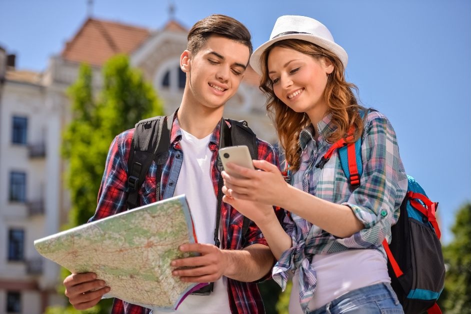 Traveler navigating through a foreign-language environment using offline maps and signs