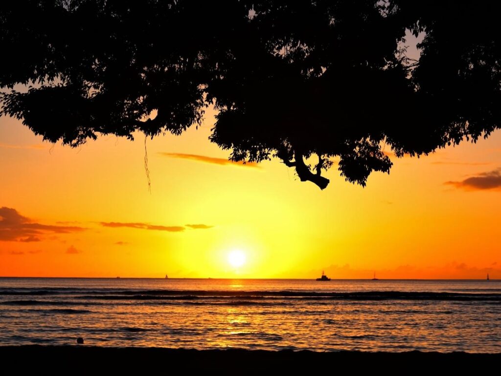 Colorful winter sunset over Waikiki Beach with dramatic clouds