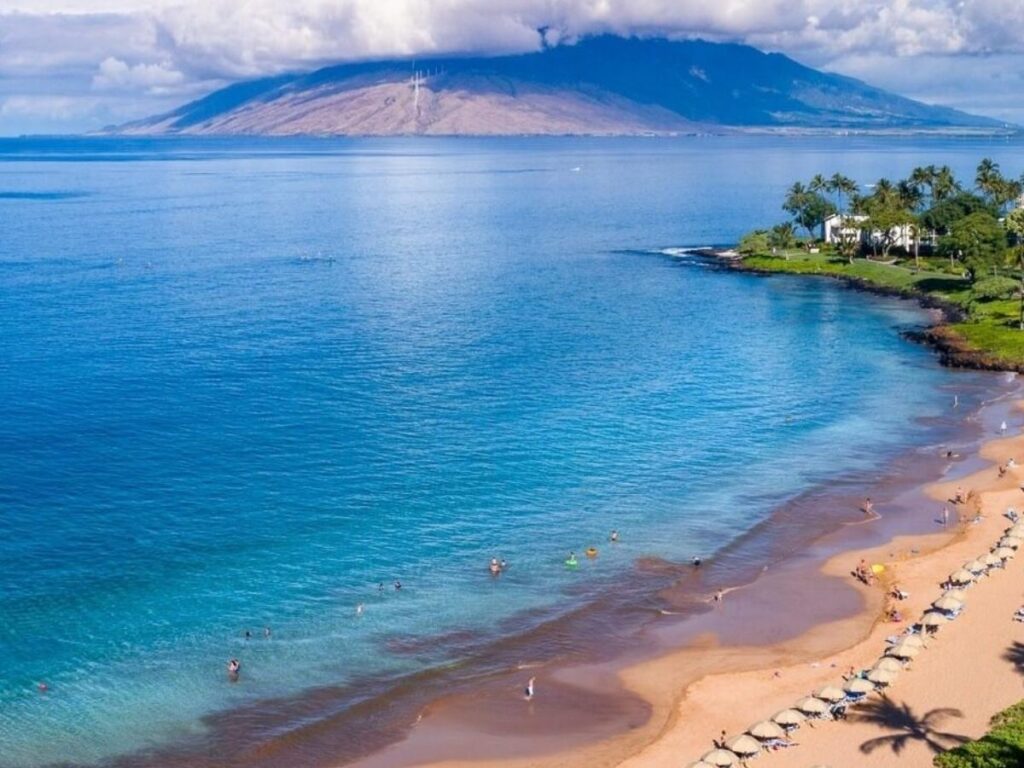 Wailea Beach in Maui with golden sand and resorts along the coastline