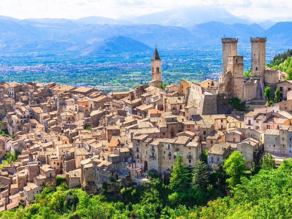 Medieval hilltop village with Gran Sasso mountains in Abruzzo, Italy