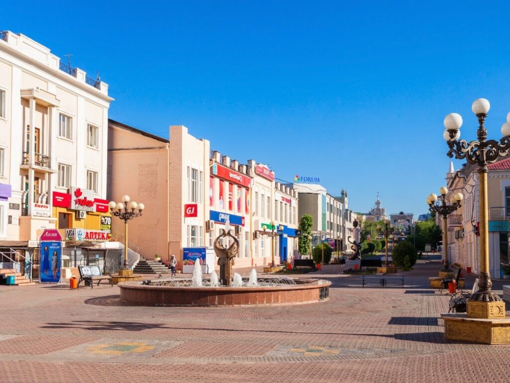 View of a vibrant street in an affordable expat city with cafés