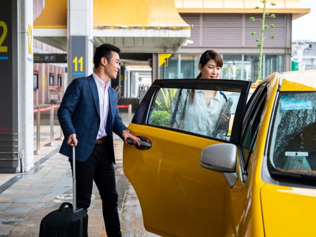 Airport taxi line and ride-share pickup area during busy hours