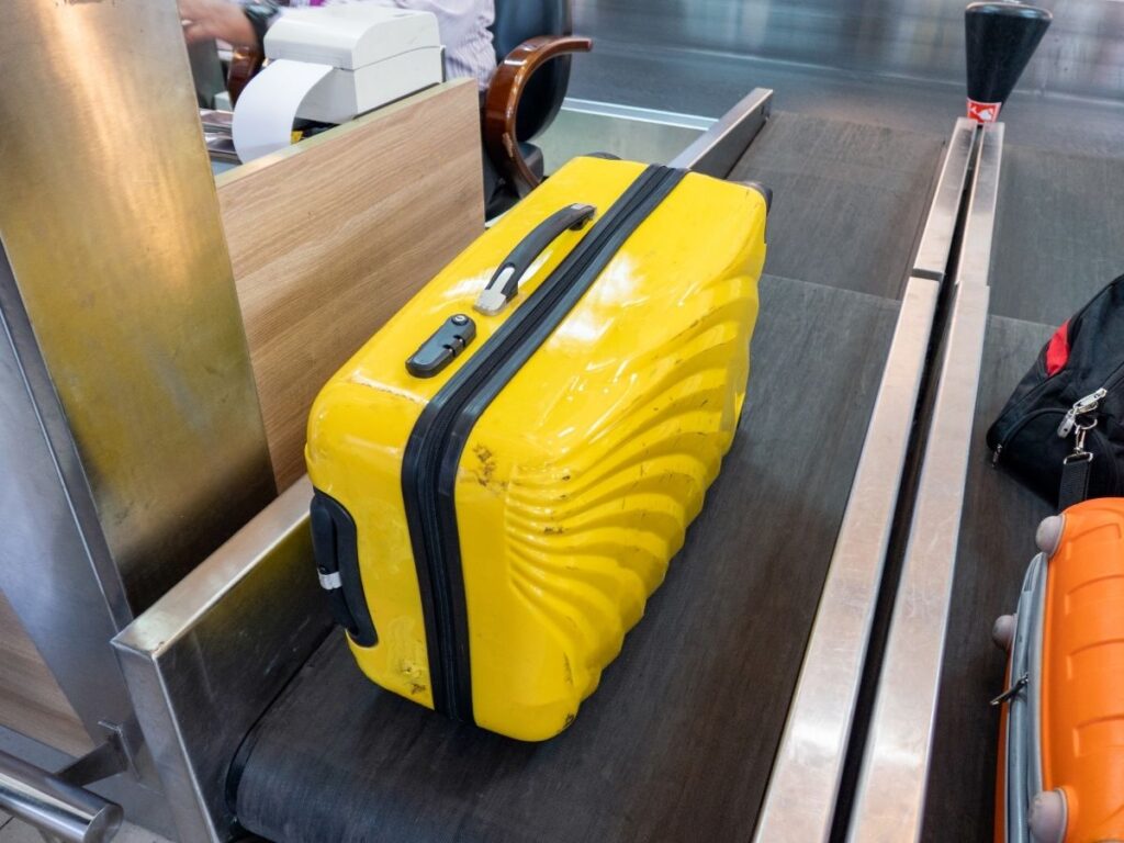 Airline worker checking bag size