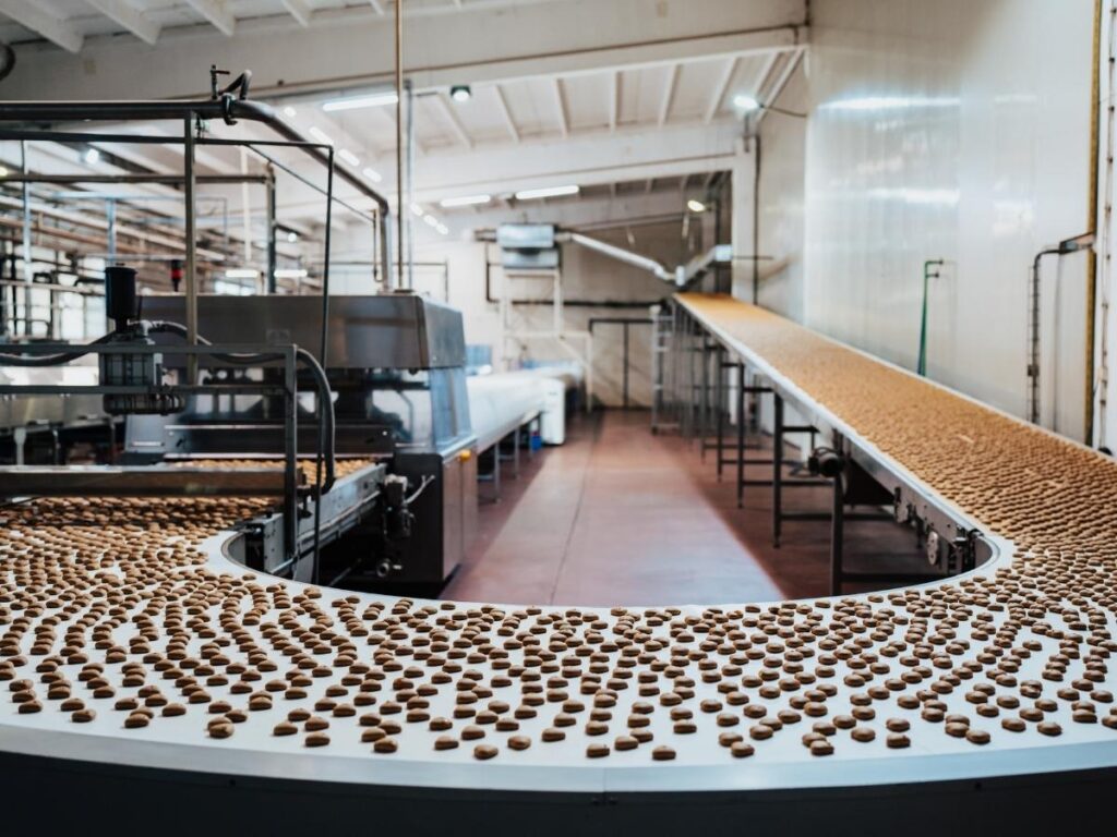 Chocolatier in Brussels preparing bean-to-bar chocolate in a workshop setting.
