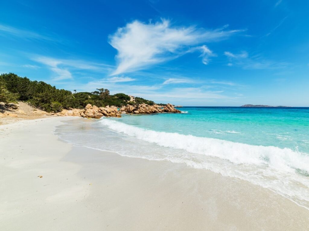 Clear emerald waters and granite rocks at Capriccioli Beach in Costa Smeralda, Sardinia