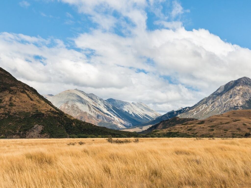 Alpine valley with peaks and trails near Craigieburn, New Zealand