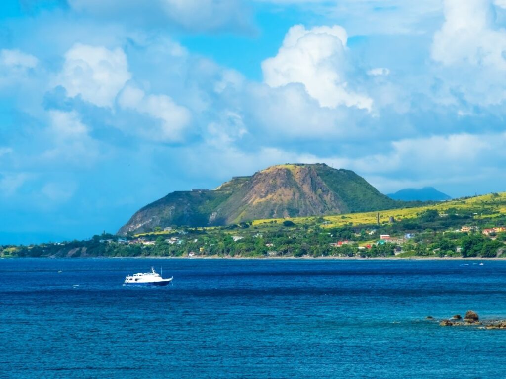 Remote tropical beach with palm trees in Dominica, Caribbean