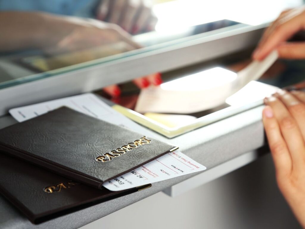 Expired passport next to flight ticket