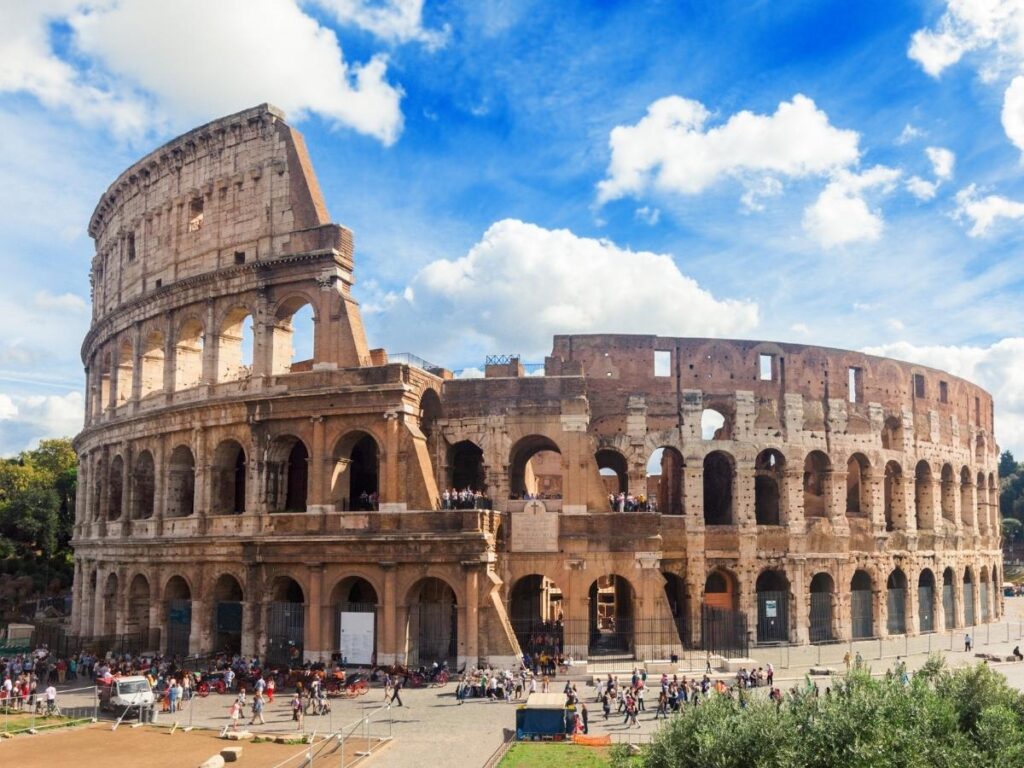 Street vendors selling tickets near the Colosseum in Rome, warning travelers to buy only from official offices.