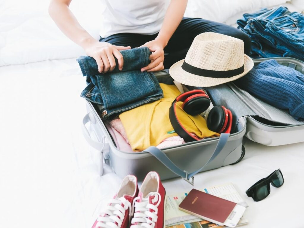 Hat, and sunglasses as accessories that elevate a minimalist French packing style.