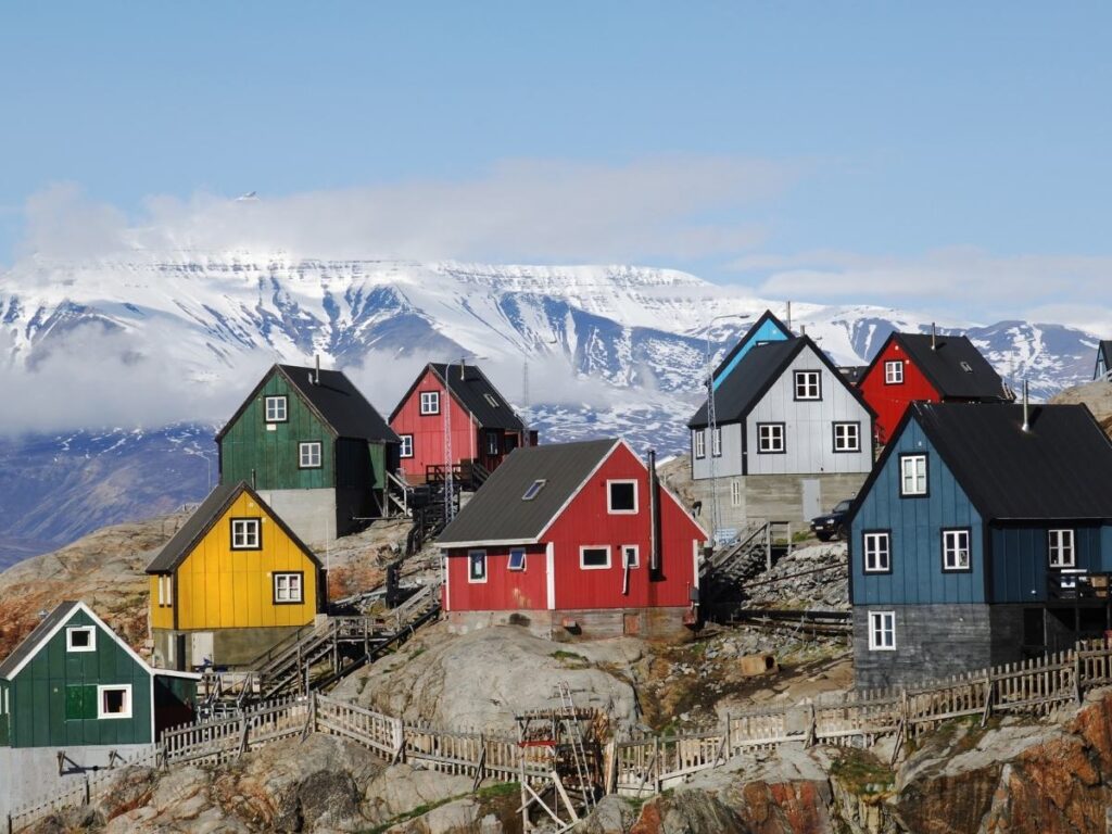 Colorful houses overlooking icy fjord in Ilulissat, Greenland