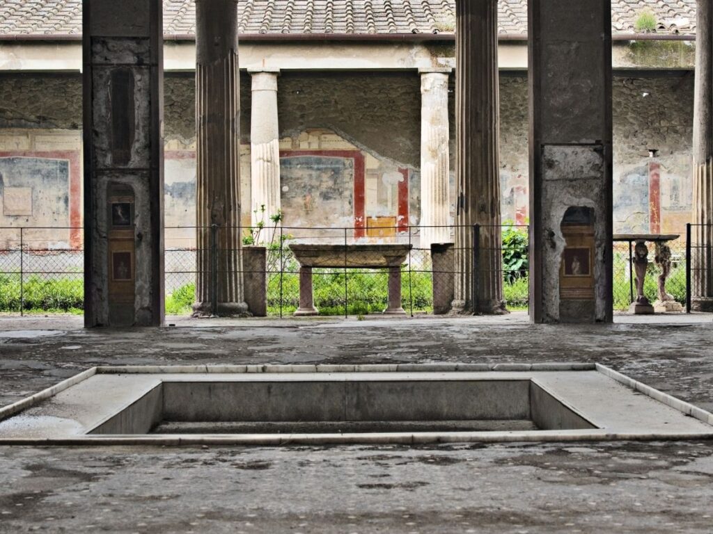 Restored fresco inside the House of the Vettii with view to garden.