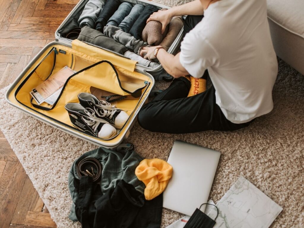 shoes arranged neatly on a small suitcase