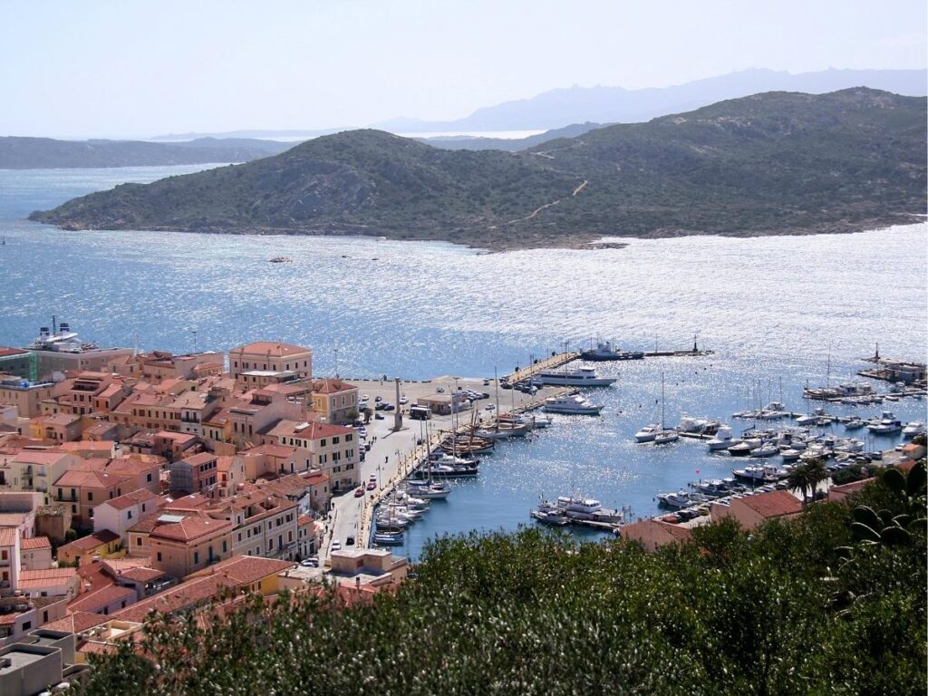Sailing boats anchored in turquoise waters near La Maddalena Archipelago islands in Sardinia