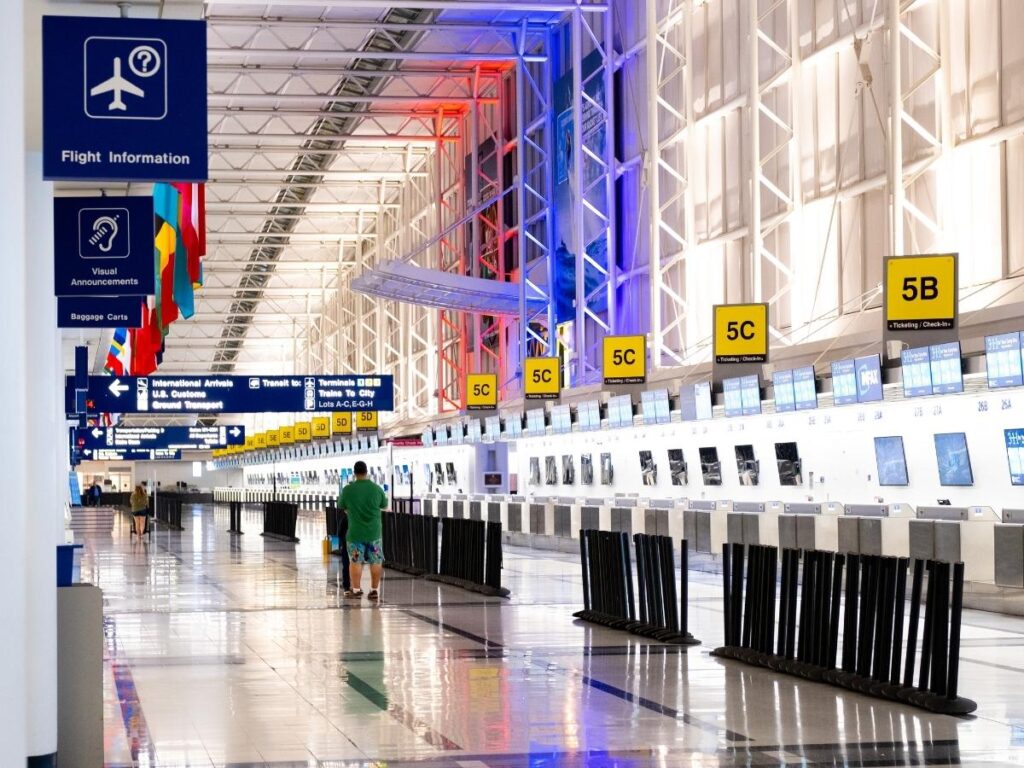 Quiet airport terminal midweek, reflecting cheaper days to fly.