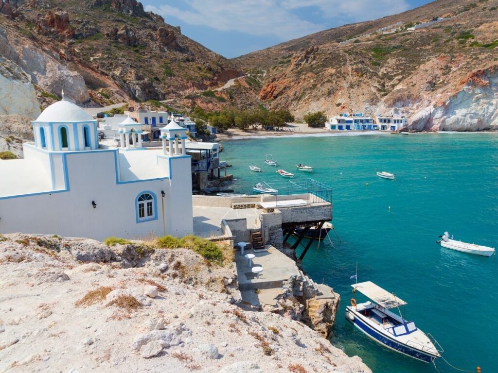 White volcanic cliffs and blue sea at Sarakiniko Beach, Milos, Greece