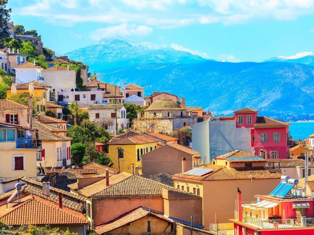 Colorful neoclassical buildings and waterfront promenade in Nafplio, Greece