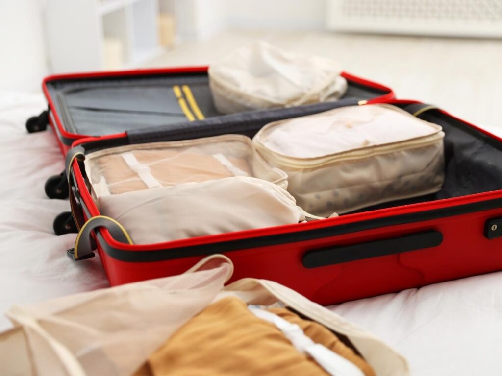 Organized suitcase with packing cubes for efficient travel packing.