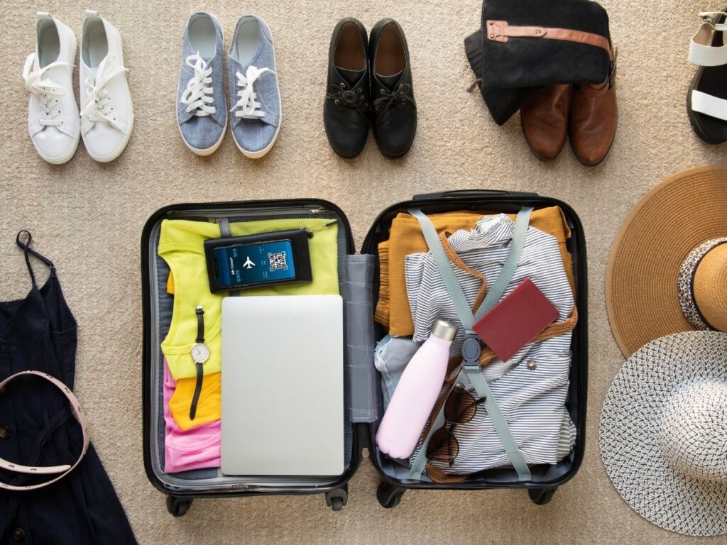 Open suitcase neatly packed with clothes and essentials