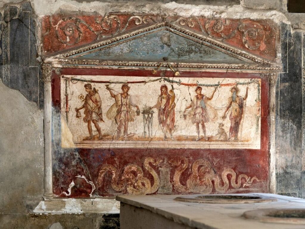 Ancient snack bar (thermopolium) in Pompeii with painted frescoes.