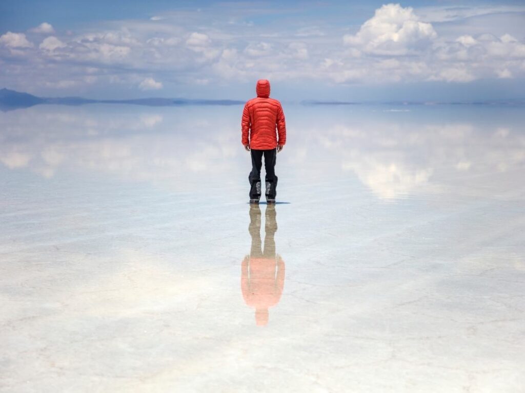 Reflection of clouds on Salar de Uyuni salt flats in Bolivia