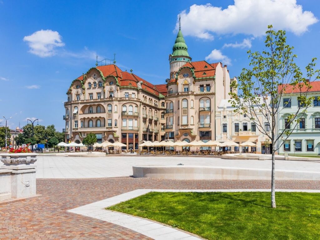 Art Nouveau buildings in Oradea Romania’s Union Square on a sunny afternoon