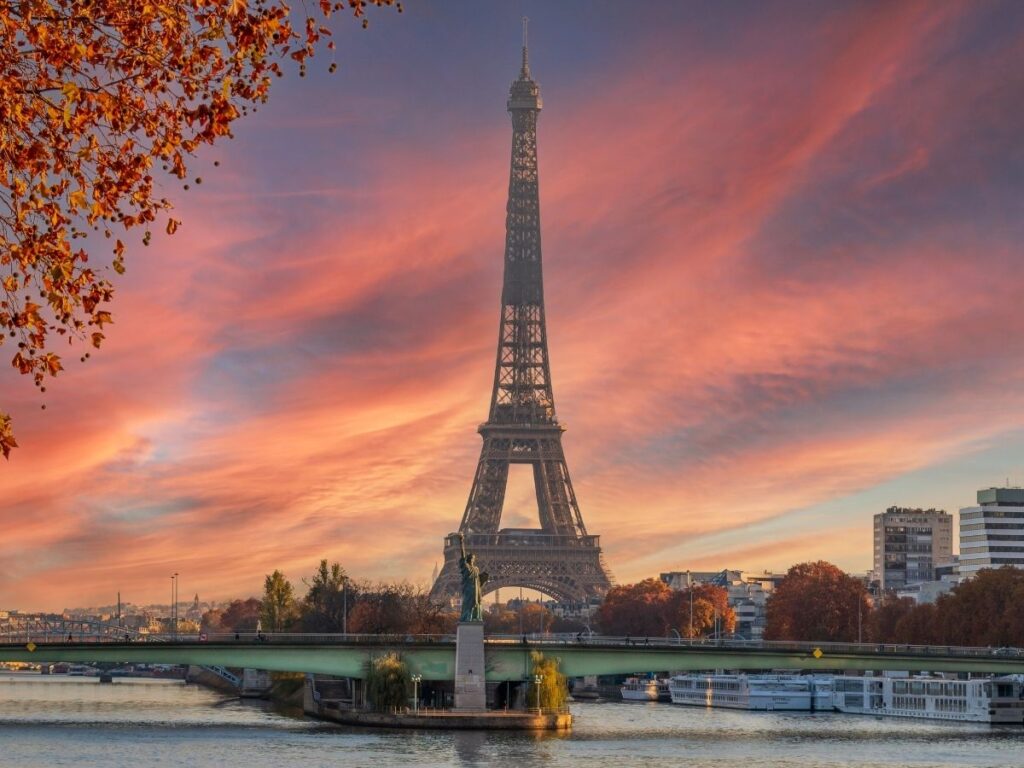 Seine River in Paris with Eiffel Tower in the distance at sunset