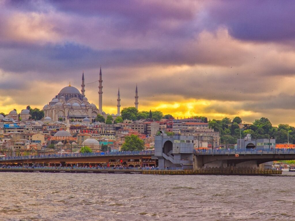 Istanbul skyline with domes, minarets, and the Bosphorus at sunset