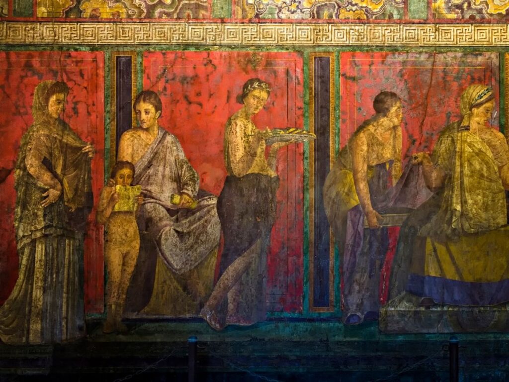 Vivid red frescoes inside the Villa of the Mysteries in Pompeii.