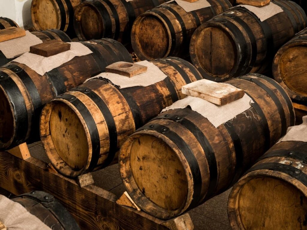 Wooden barrels aging traditional balsamic vinegar inside Acetaia Malpighi in Modena