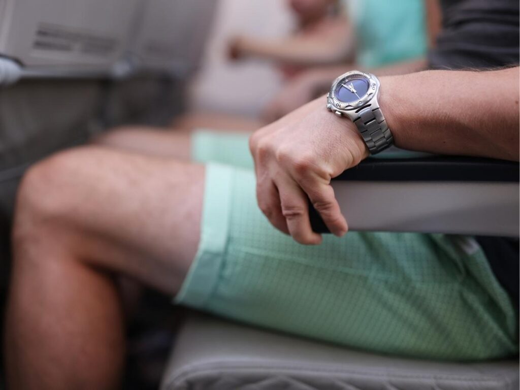 passenger using both armrests