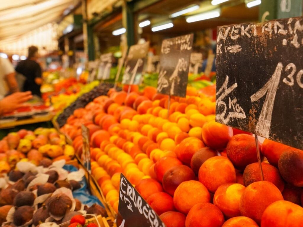 Busy stalls at Alba Saturday market with truffles and local produce
