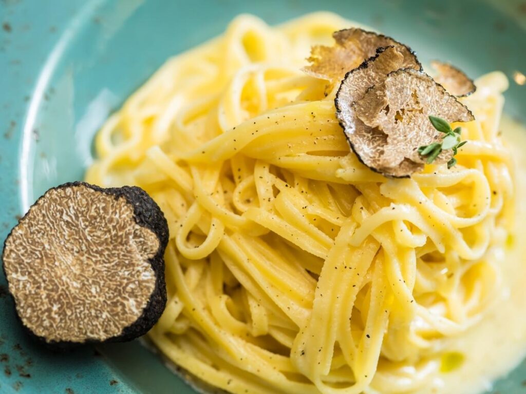 Tajarin pasta topped with freshly shaved white truffle in Alba, Piedmont