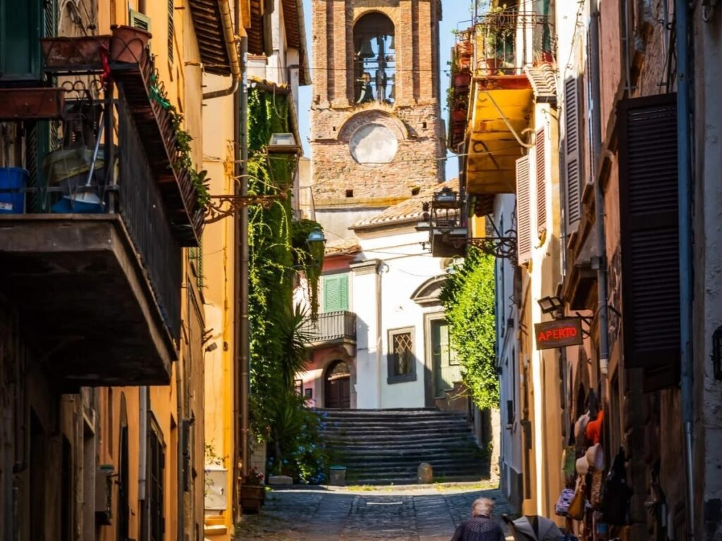 Cobbled lakeside street and colorful houses in Anguillara Sabazia"