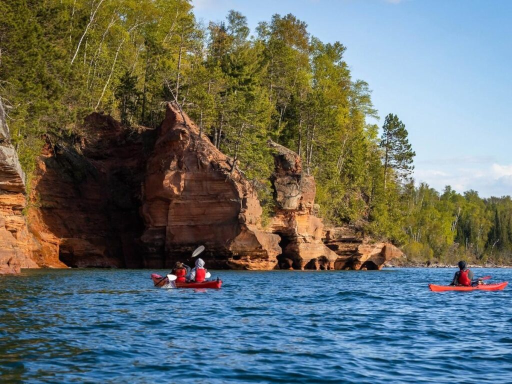 Boat tour entering hidden sea caves along the coast near Polignano.