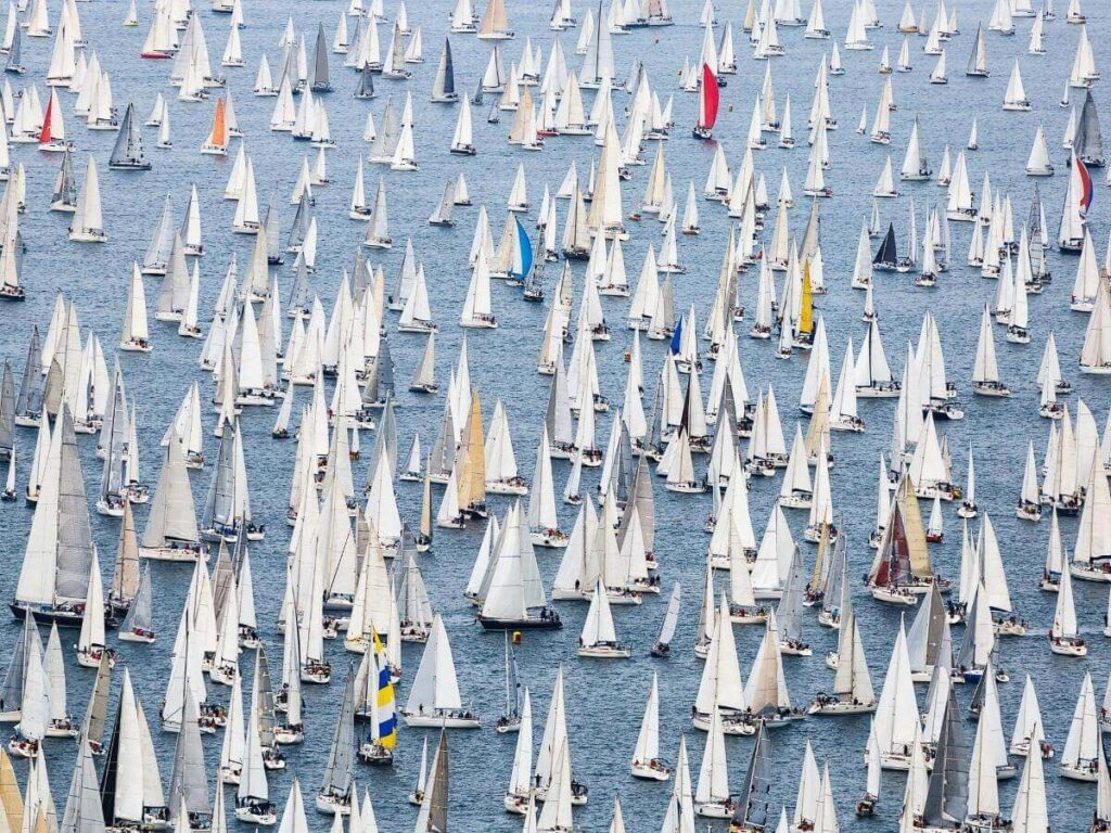 “Hundreds of sails racing in the Gulf of Trieste during the Barcolana Regatta.”