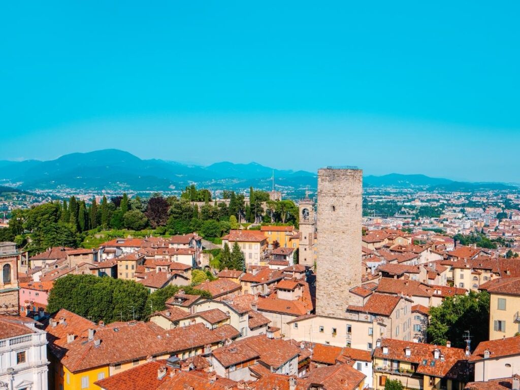 Funicular ascending to Bergamo Città Alta with the old town in view.