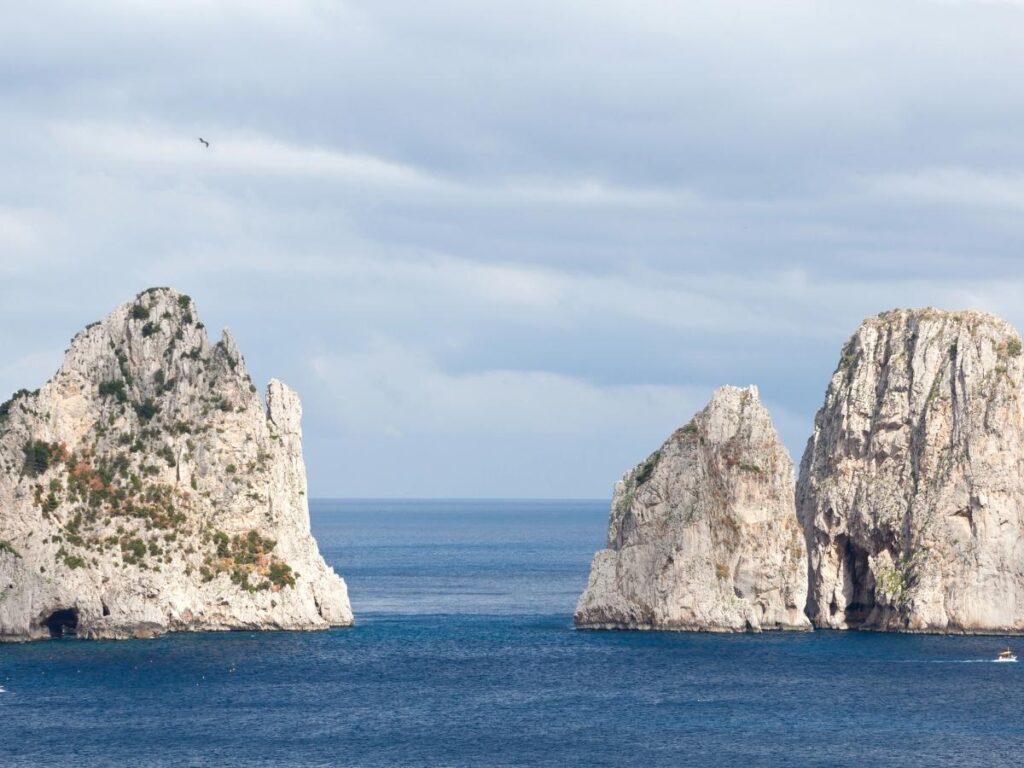 Capri’s Faraglioni rocks rising from turquoise water.