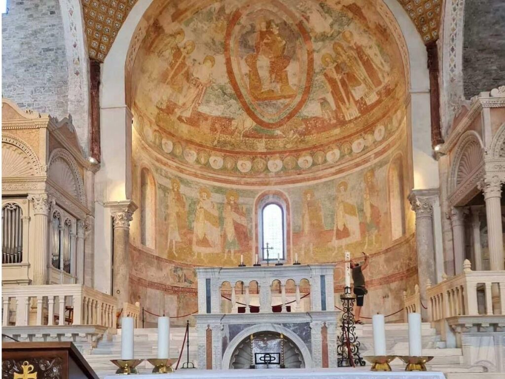 Interior view of the Tempietto Longobardo showing ornate Lombard carvings