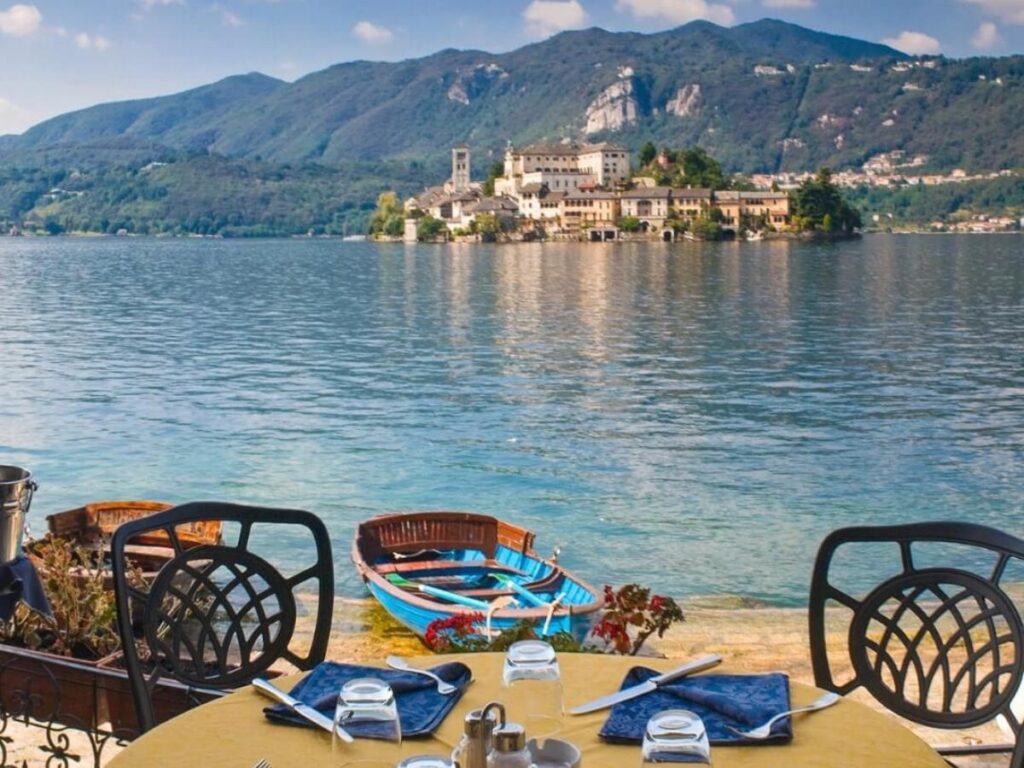 Isola San Giulio on Lake Orta with waterfront of Orta San Giulio