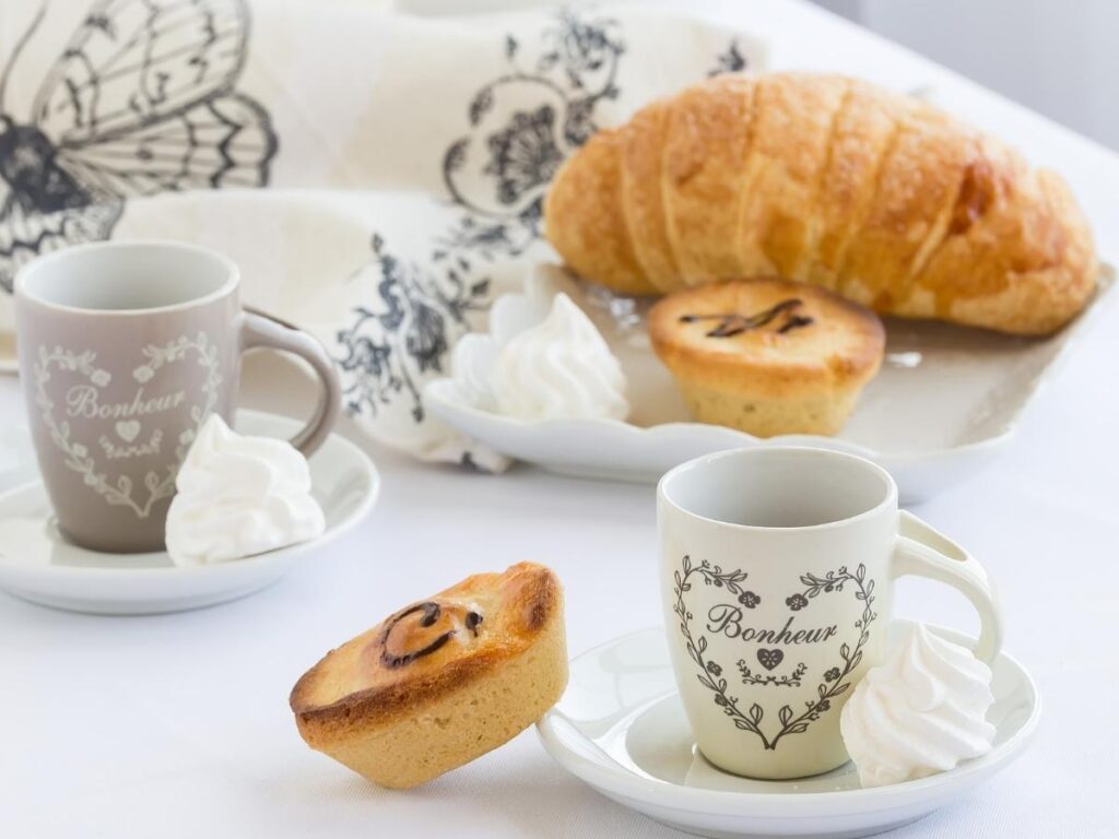 Warm pasticciotto pastry filled with custard served with espresso in Lecce.